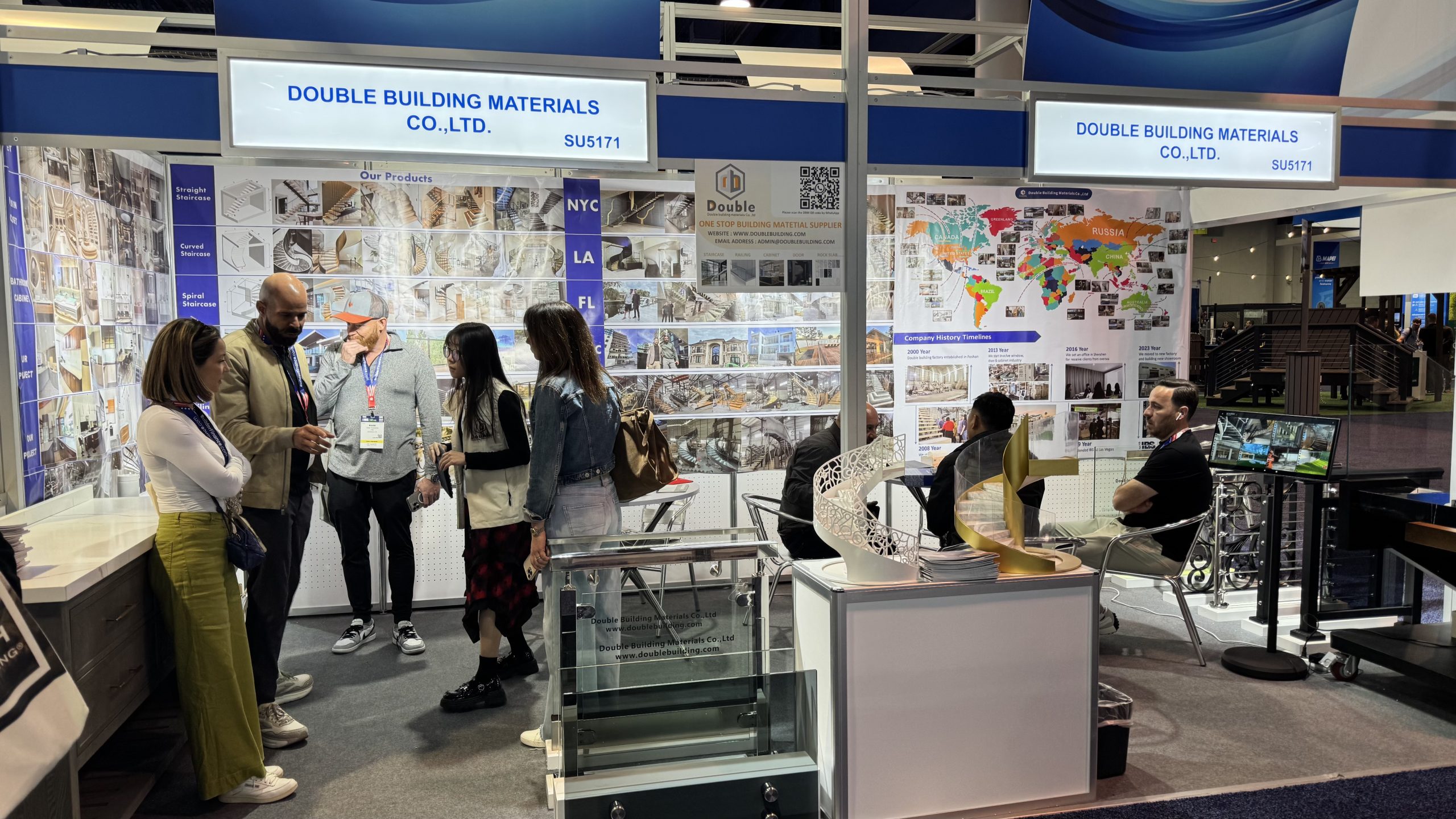 Double Building Materials team discussing staircase specifications with US builders at IBS 2025